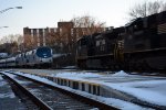 NS train 13R meets Amtrak #20(21) as it waits for its relief engineer to arrive